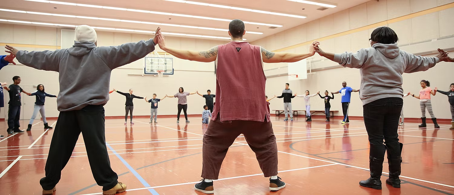 Tribal Qi Gong group workshop in a gym